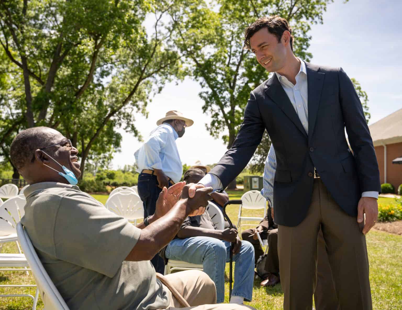 Senator Ossoff shaking hands with a constituent outside in Fort Valley, Georgia.